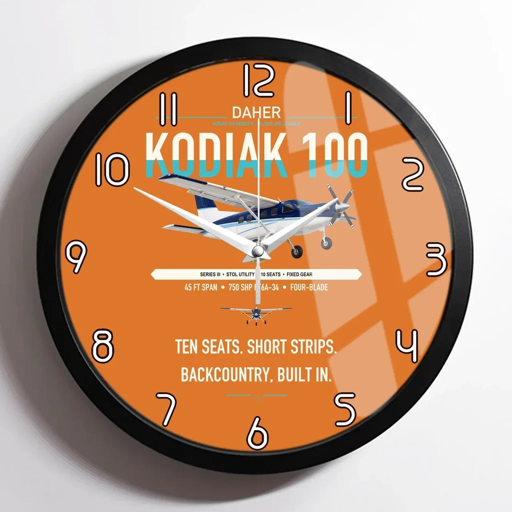 Daher Kodiak 100 Series III design on orange framed wall clock