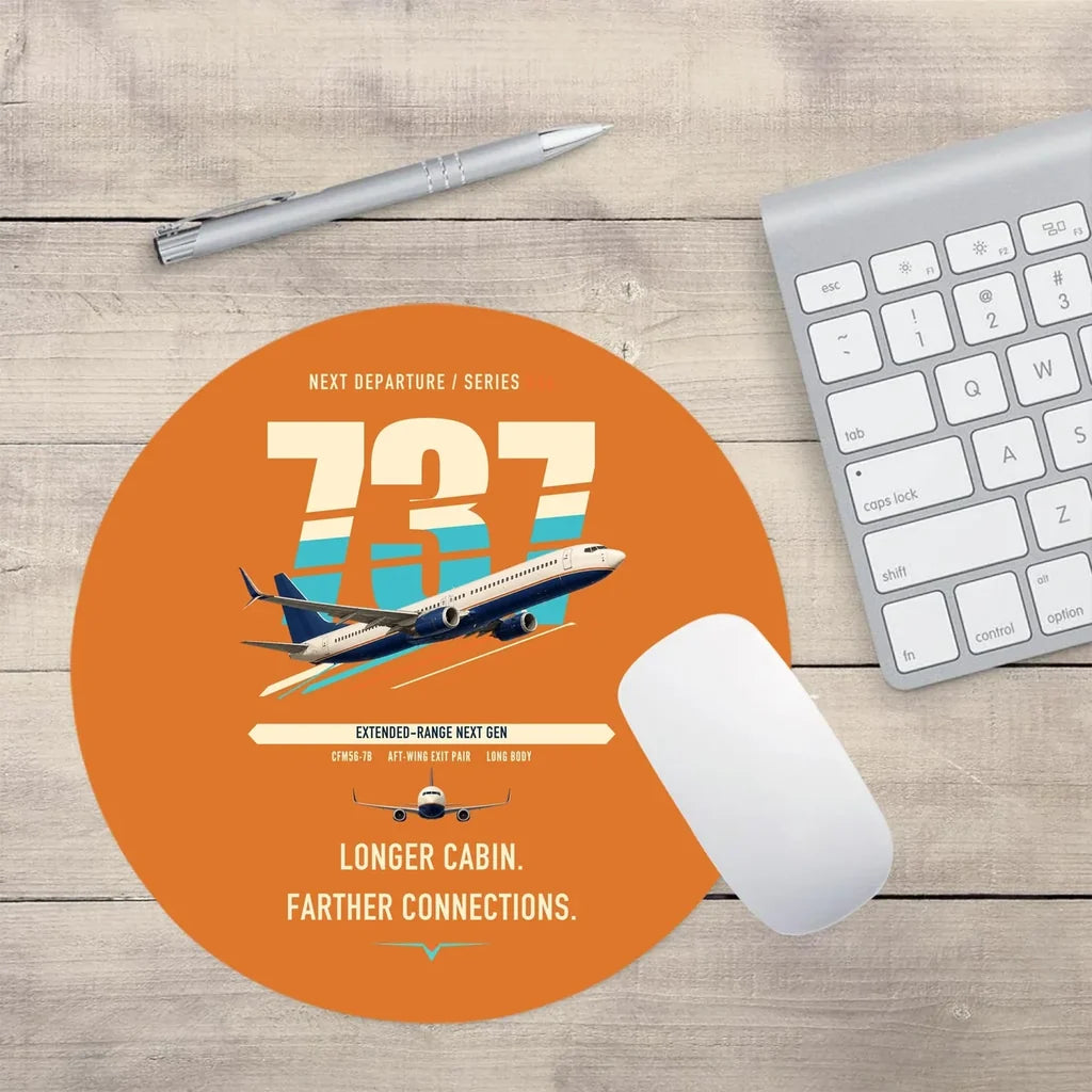 Boeing 737-900ER design on orange round mouse pad