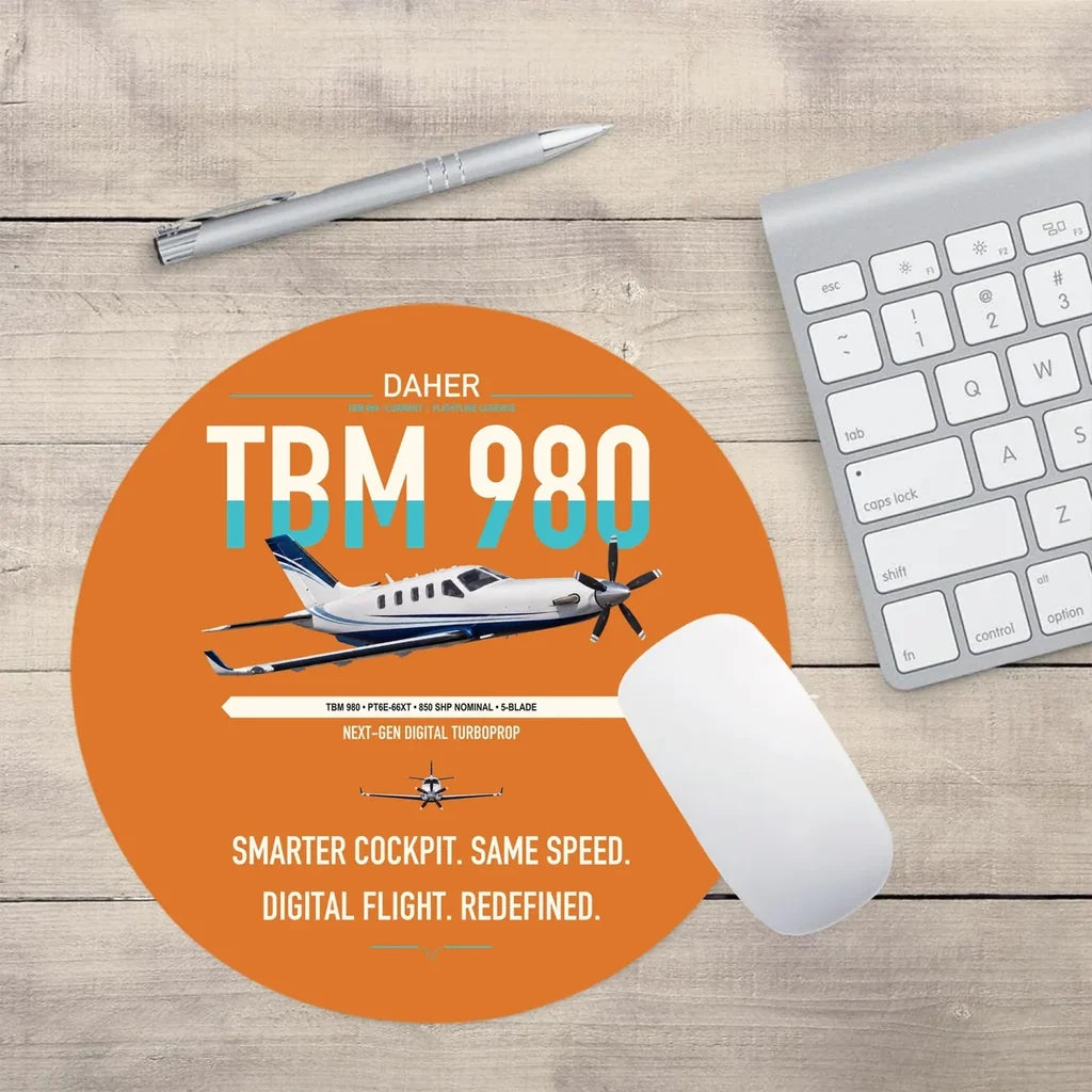 Daher TBM 980 design on orange round mouse pad