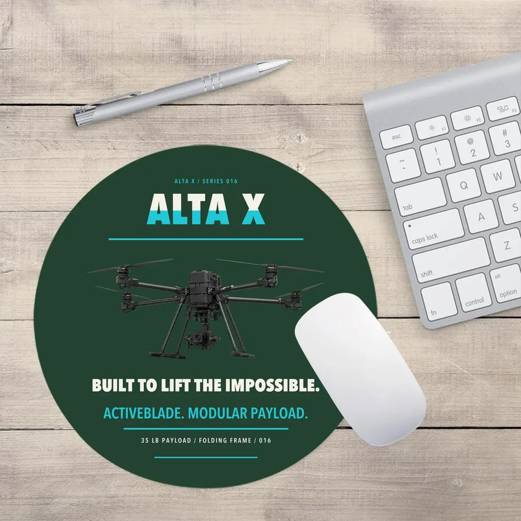 Freefly Alta X design on dark green round mouse pad
