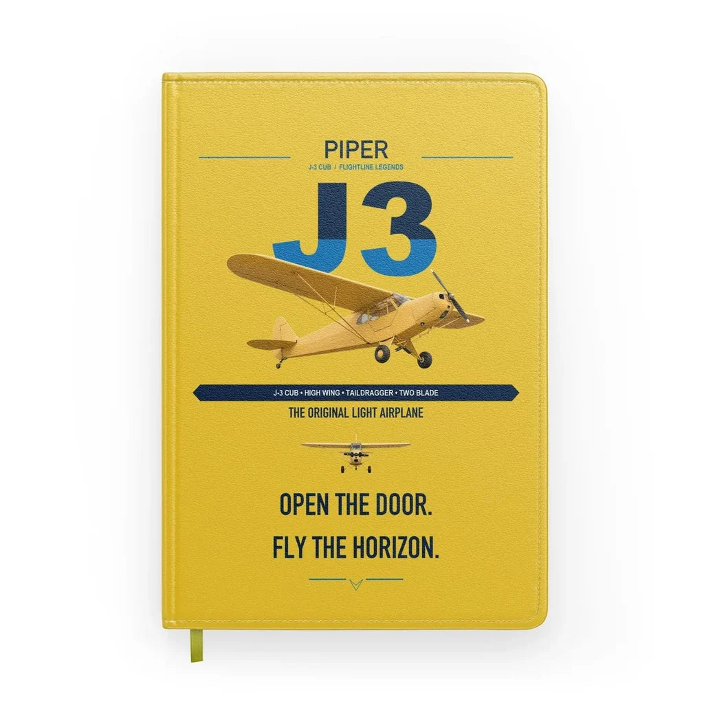 Piper J-3 Cub design on yellow notebook