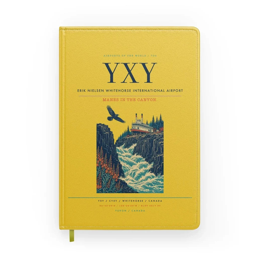 Erik Nielsen Whitehorse International Airport (YXY) design on yellow notebook