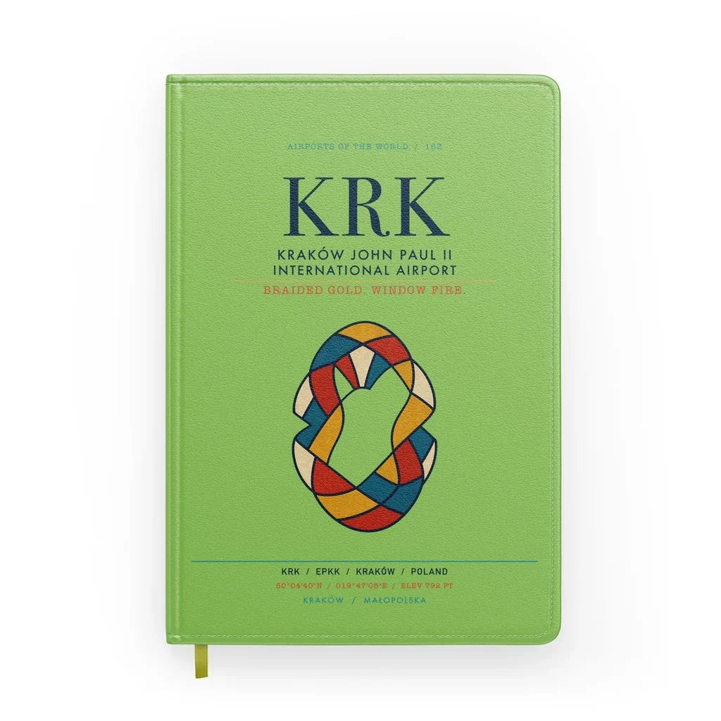 Kraków John Paul II International Airport (KRK) design on light green notebook