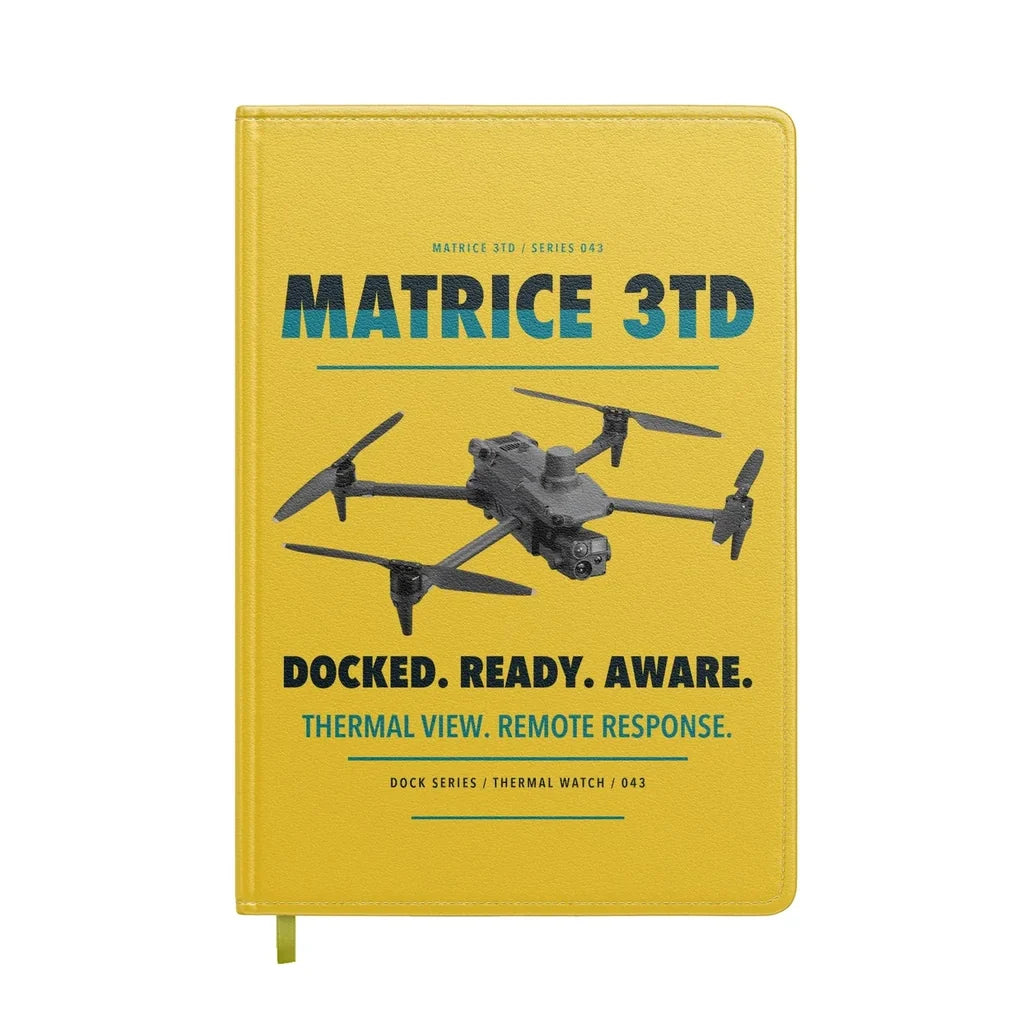 DJI Matrice 3TD design on yellow notebook