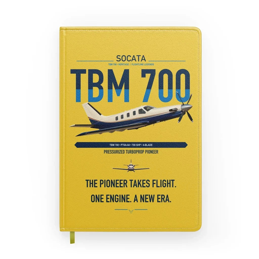 Socata TBM 700 design on yellow notebook