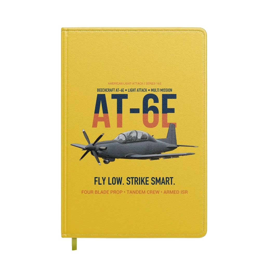 AT-6E Wolverine Light Attack design on yellow notebook