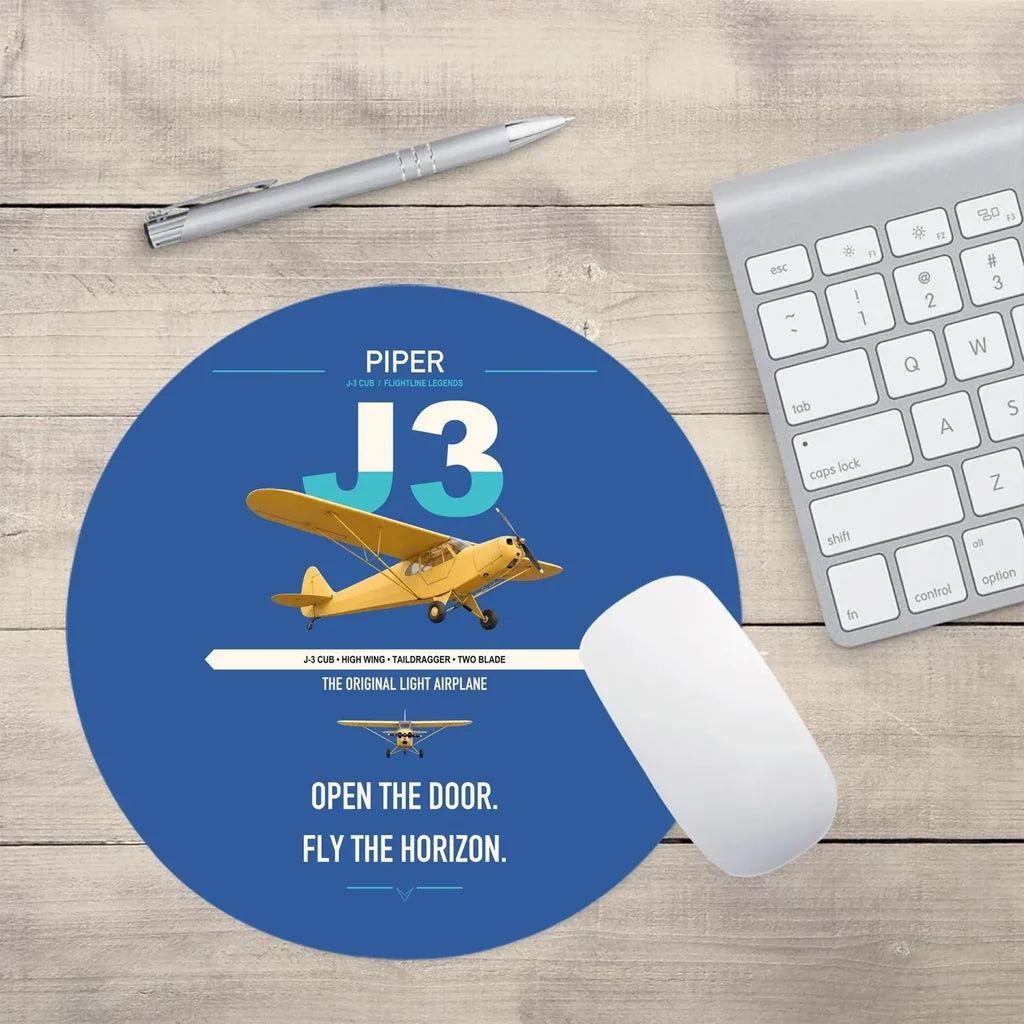 Piper J-3 Cub design on blue round mouse pad
