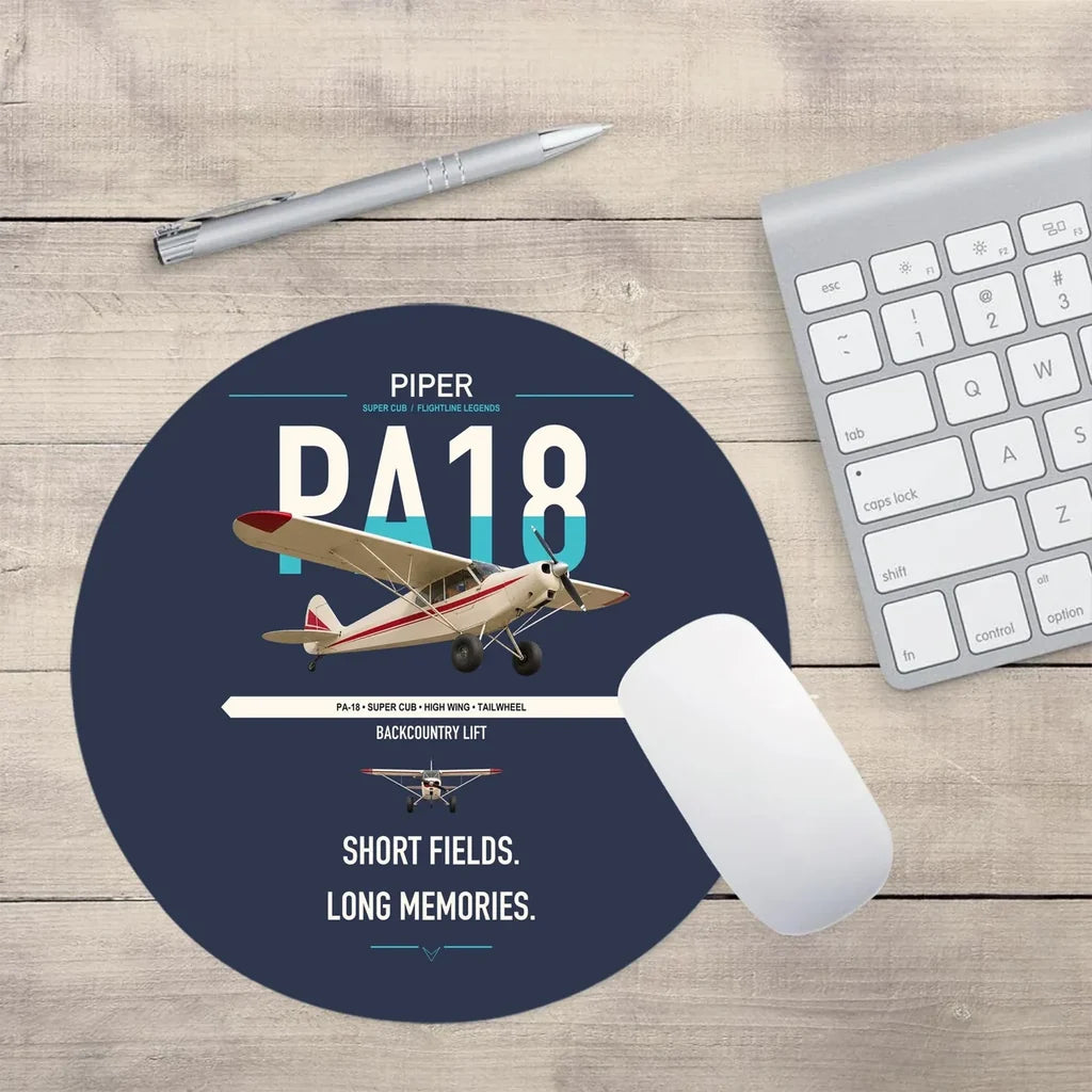 Piper PA-18 Super Cub design on navy blue round mouse pad