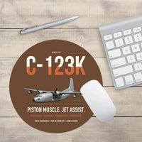 Thumbnail for C-123K Provider design on brown round mouse pad