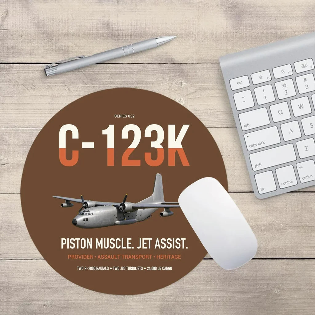 C-123K Provider design on brown round mouse pad