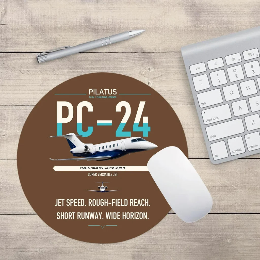 Pilatus PC-24 design on brown round mouse pad