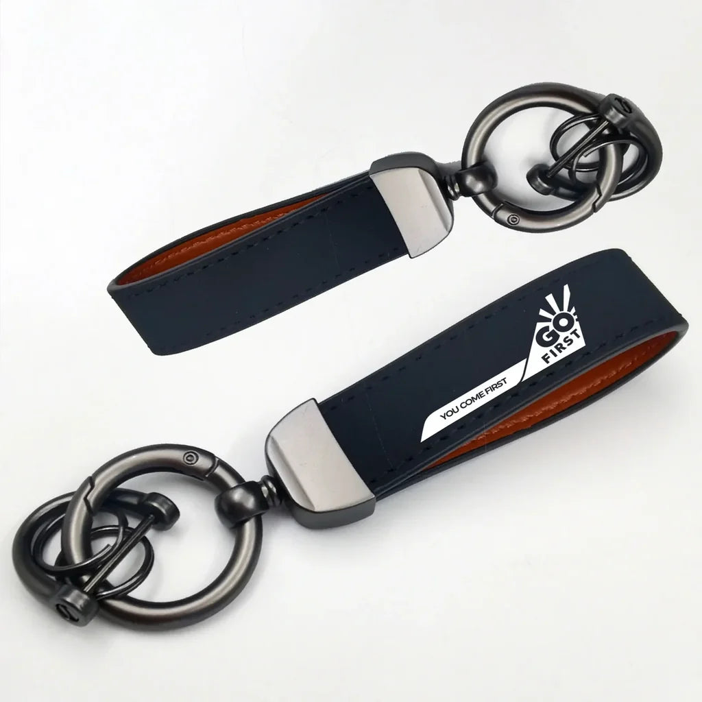 Go First Horseshoe Buckle key chain in navy blue
