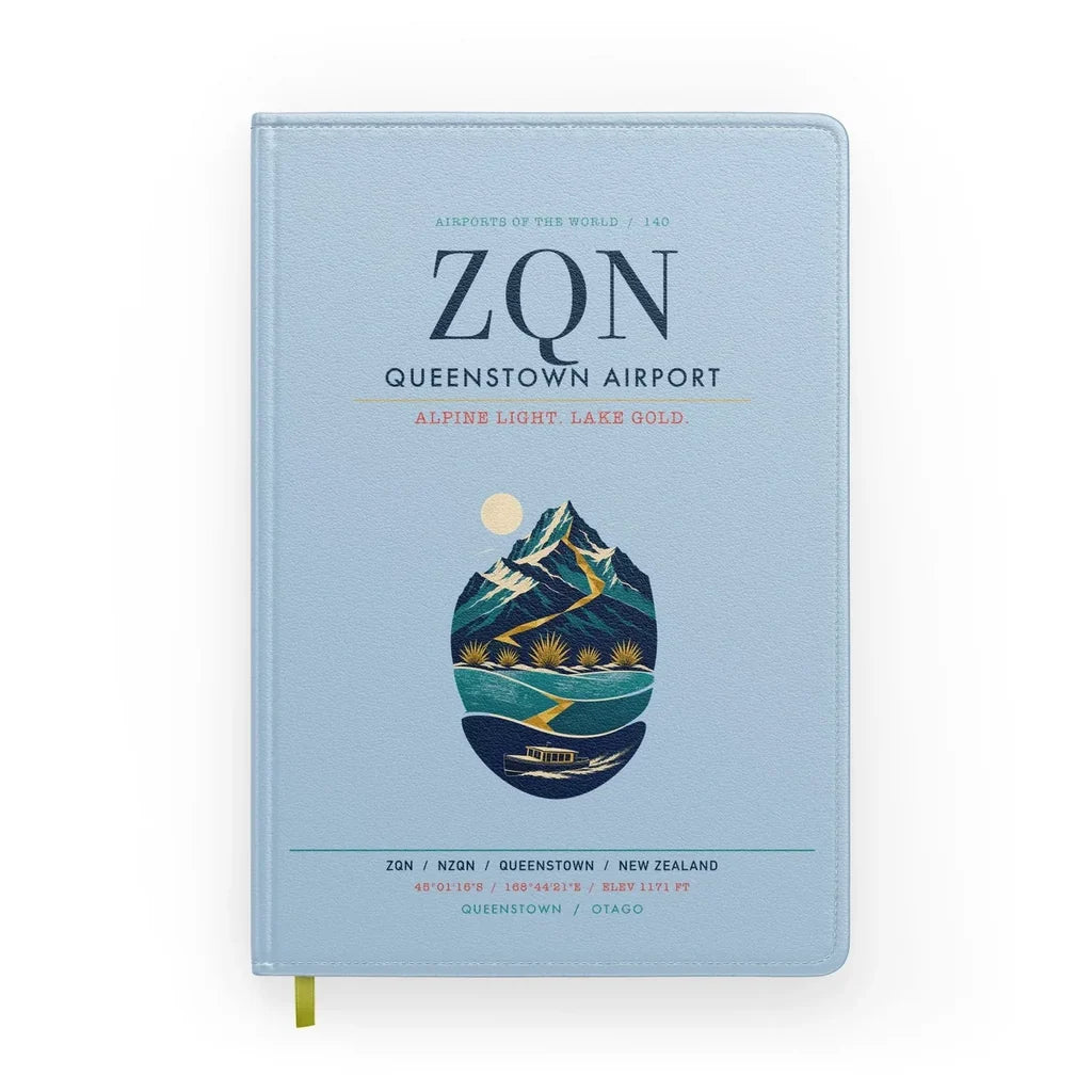 Queenstown Airport (ZQN) design on light blue notebook