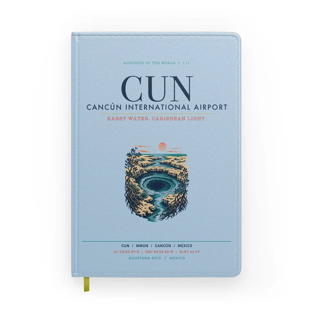 Cancún International Airport (CUN) design on light blue notebook