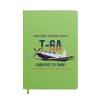 Thumbnail for T-6A Texan II Train The Next Generation design on light green notebook