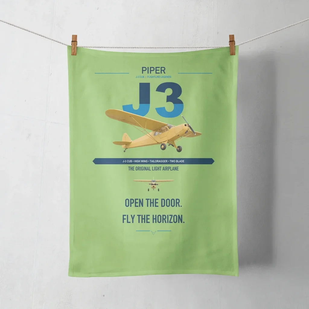 Piper J-3 Cub design on light green towel
