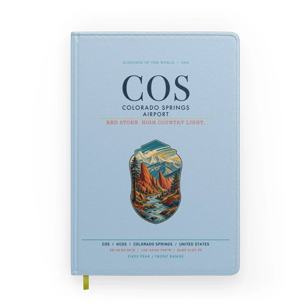 Colorado Springs Airport (COS) design on light blue notebook