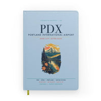 Thumbnail for Portland International Airport (PDX) design on light blue notebook