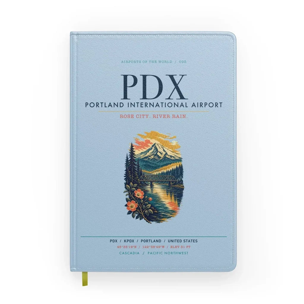 Portland International Airport (PDX) design on light blue notebook