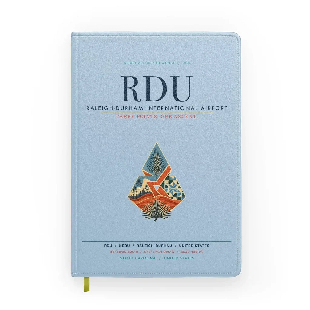 Raleigh-Durham International Airport (RDU) design on light blue notebook