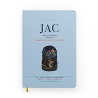 Thumbnail for Jackson Hole Airport (JAC) design on light blue notebook