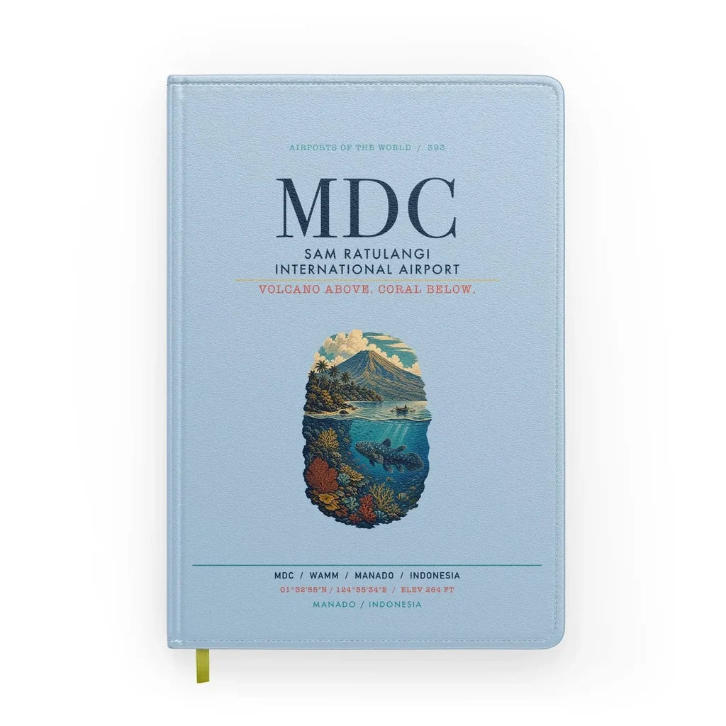 Sam Ratulangi International Airport Manado (MDC) design on light blue notebook