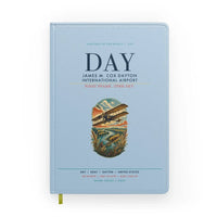 Thumbnail for James M. Cox Dayton International Airport (DAY) design on light blue notebook