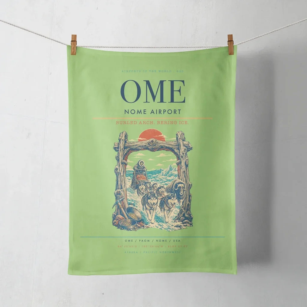 Nome Airport (OME) design on light green towel