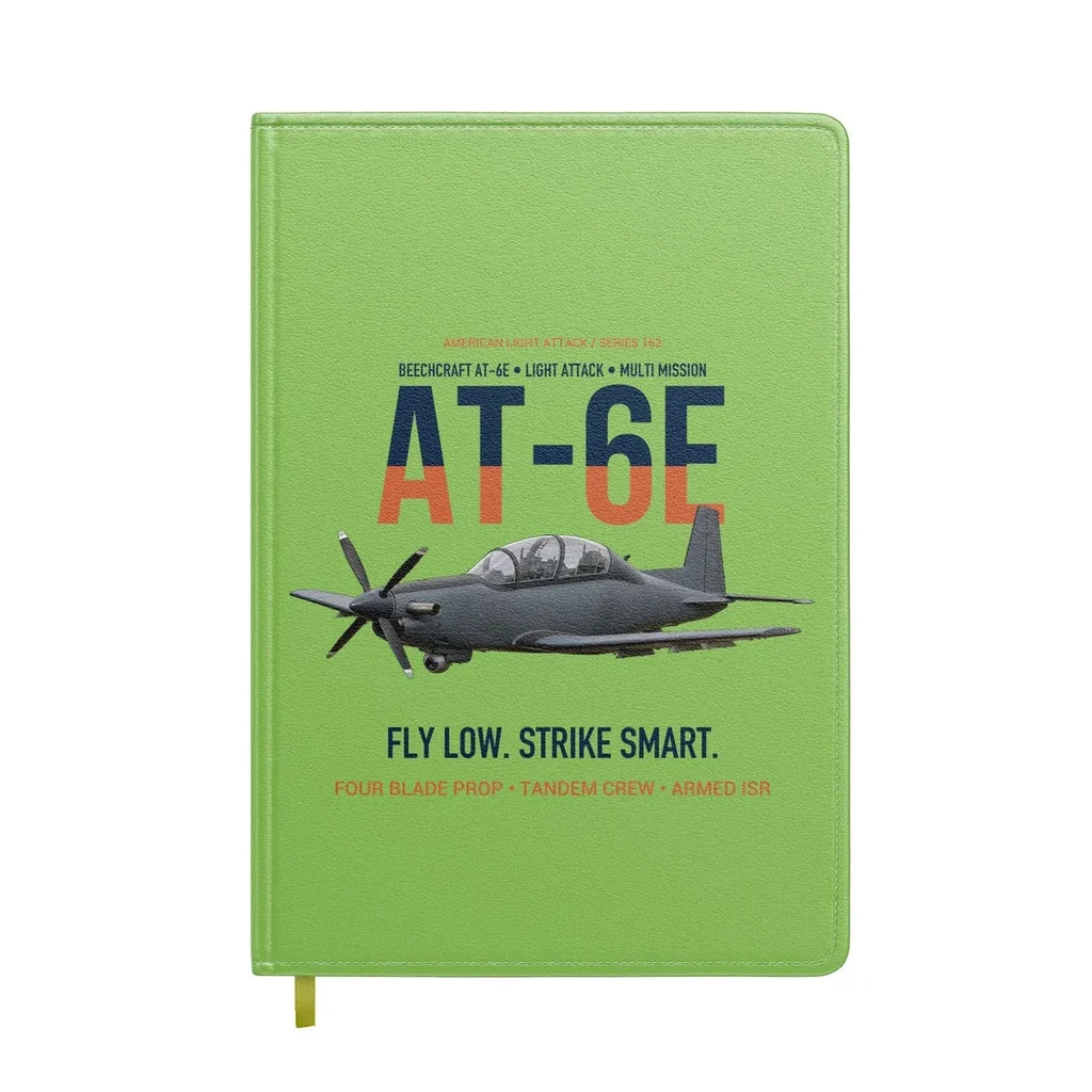 AT-6E Wolverine Light Attack design on light green notebook