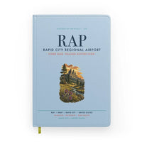 Thumbnail for Rapid City Regional Airport (RAP) design on light blue notebook