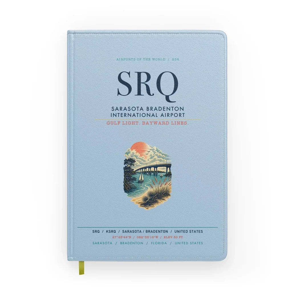 Sarasota Bradenton International Airport (SRQ) design on light blue notebook