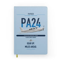 Thumbnail for Piper PA-24-250 Comanche 250 design on light blue notebook
