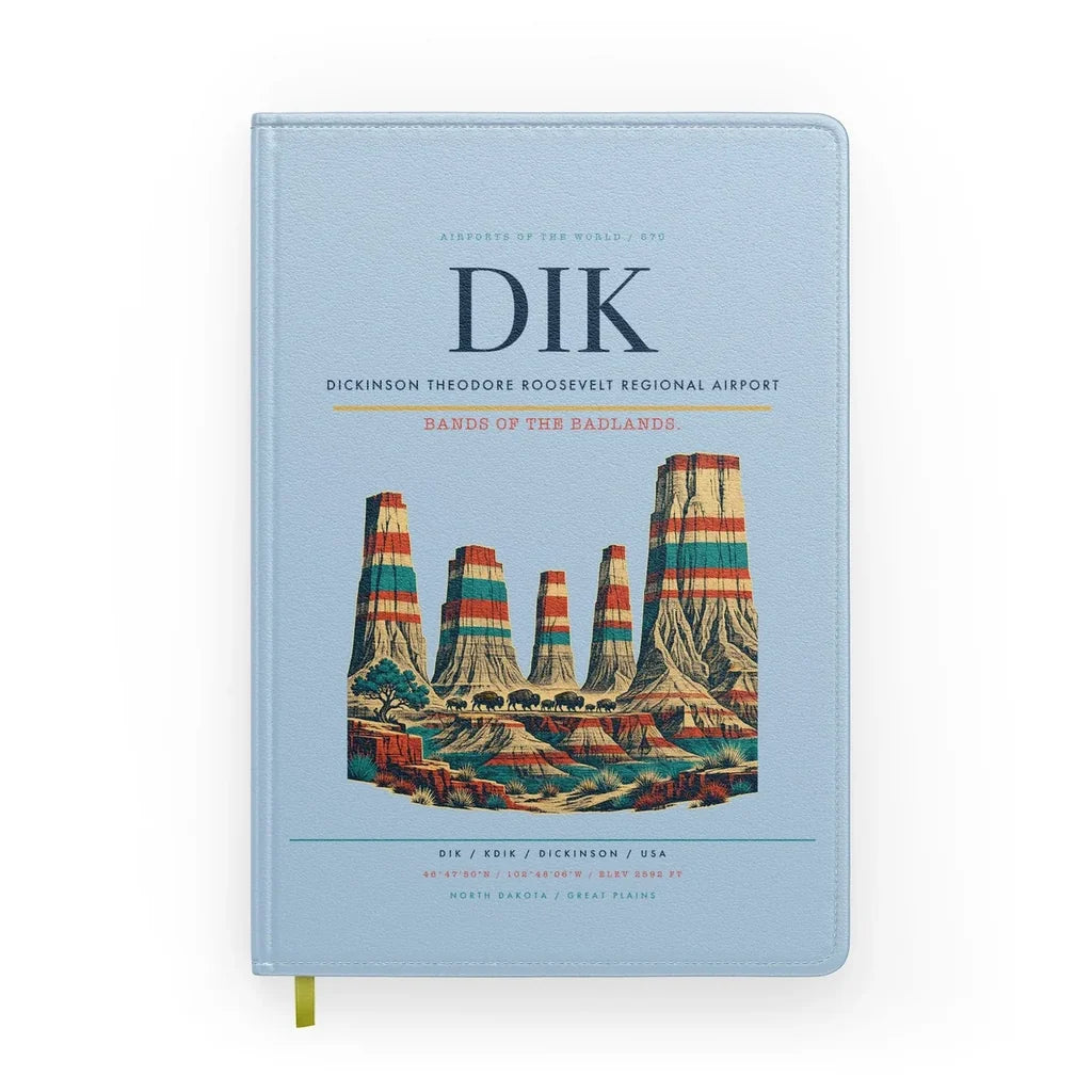 Dickinson Theodore Roosevelt Regional Airport (DIK) design on light blue notebook