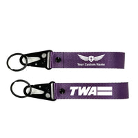 Thumbnail for Trans World Airlines (TWA) Hawk-shaped key chain, Purple+ NAME