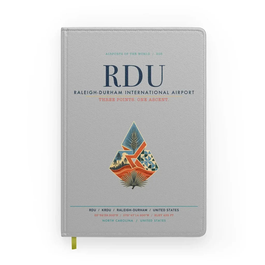 Raleigh-Durham International Airport (RDU) design on light gray notebook