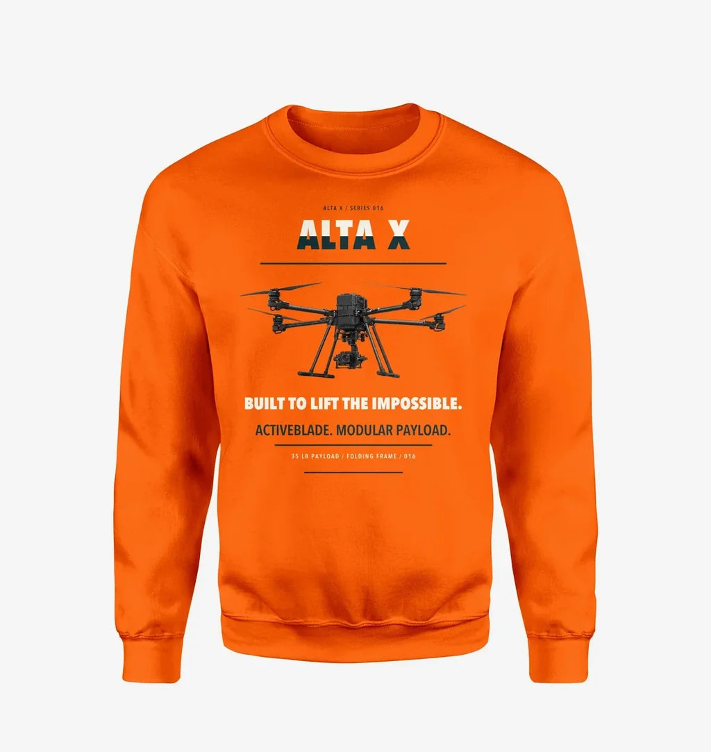 Freefly Alta X design on orange sweatshirt