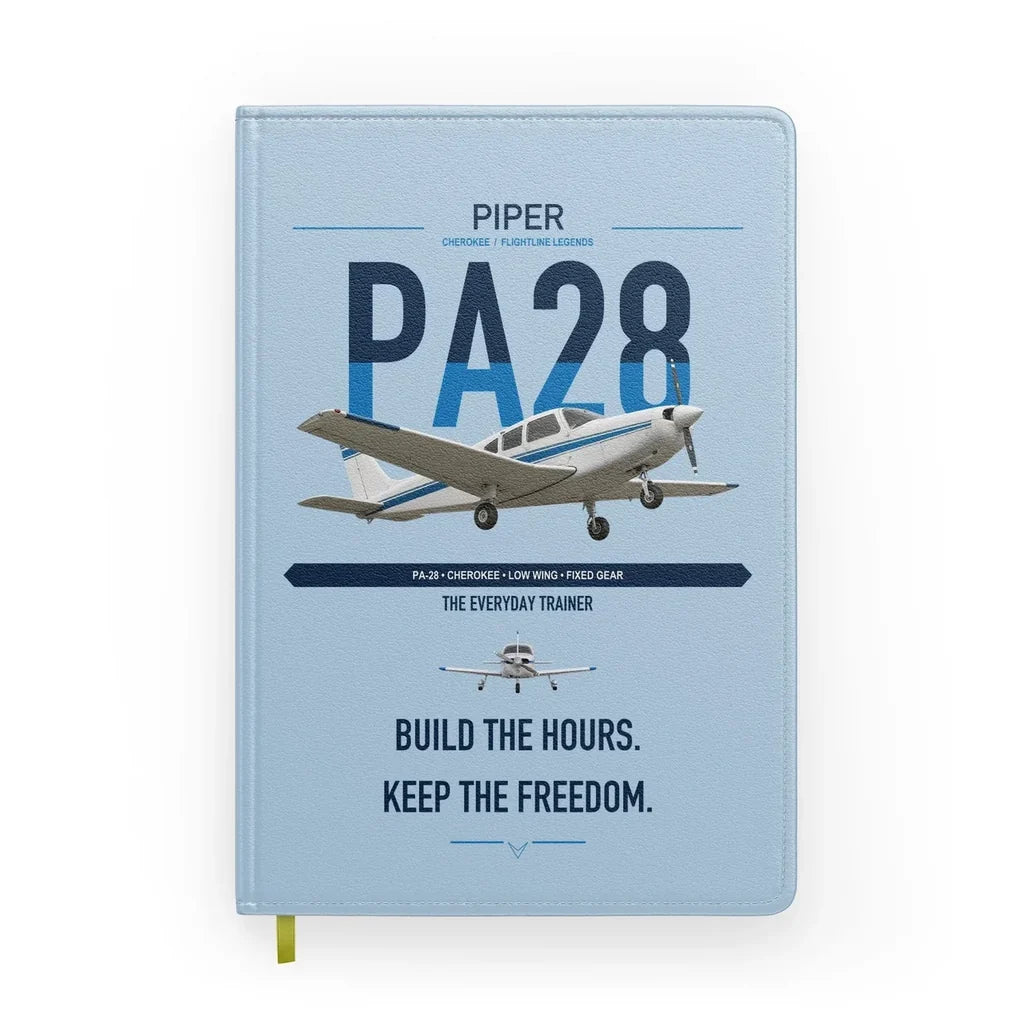 Piper PA-28 Cherokee design on light blue notebook