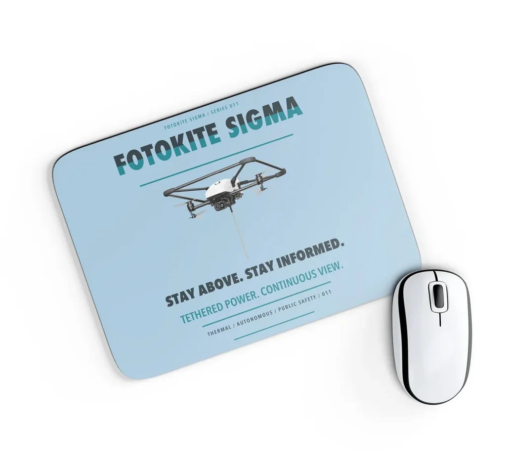 Fotokite Sigma design on light blue rectangle mouse pad