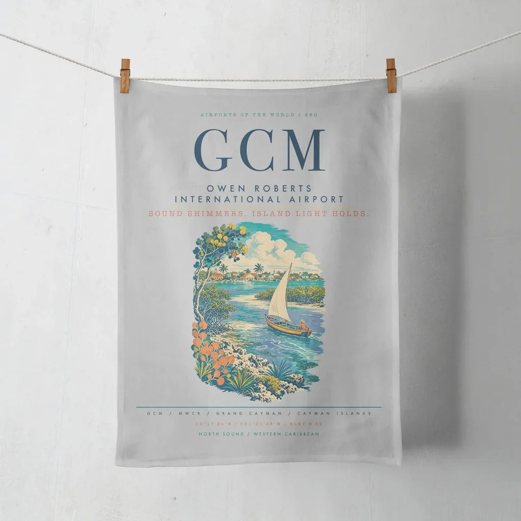 Owen Roberts International Airport (GCM) design on light gray towel