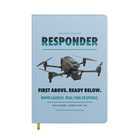 Thumbnail for BRINC Responder design on light blue notebook