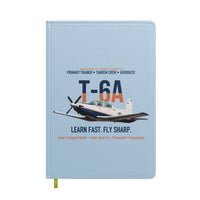 Thumbnail for T-6A Texan II Train The Next Generation design on light blue notebook