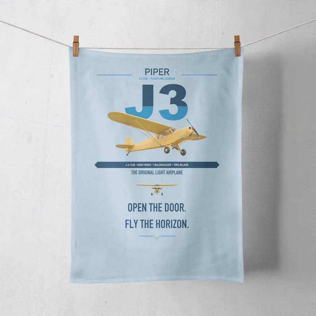 Piper J-3 Cub design on light blue towel