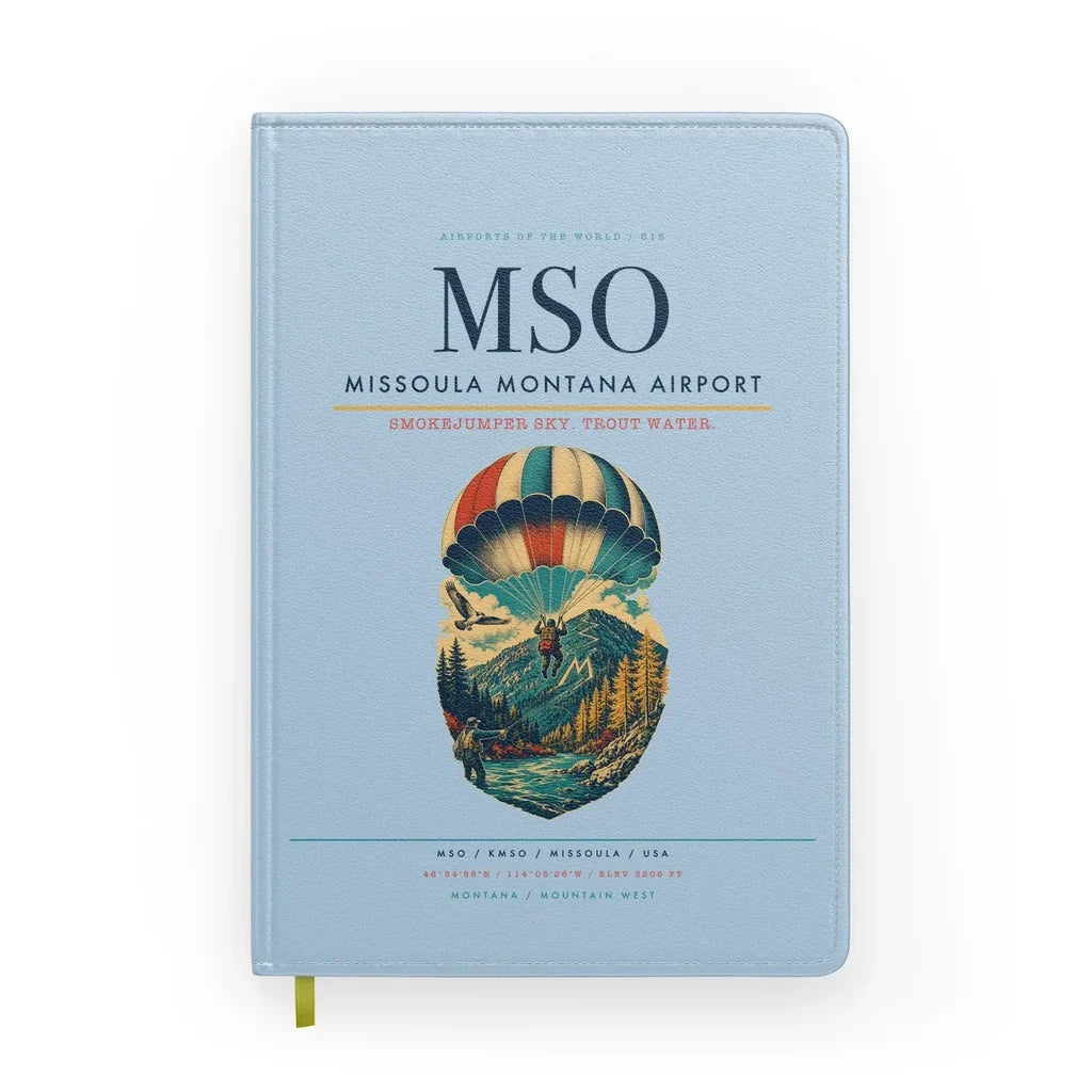 Missoula Montana Airport (MSO) design on light blue notebook