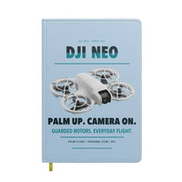 Thumbnail for DJI Neo design on light blue notebook