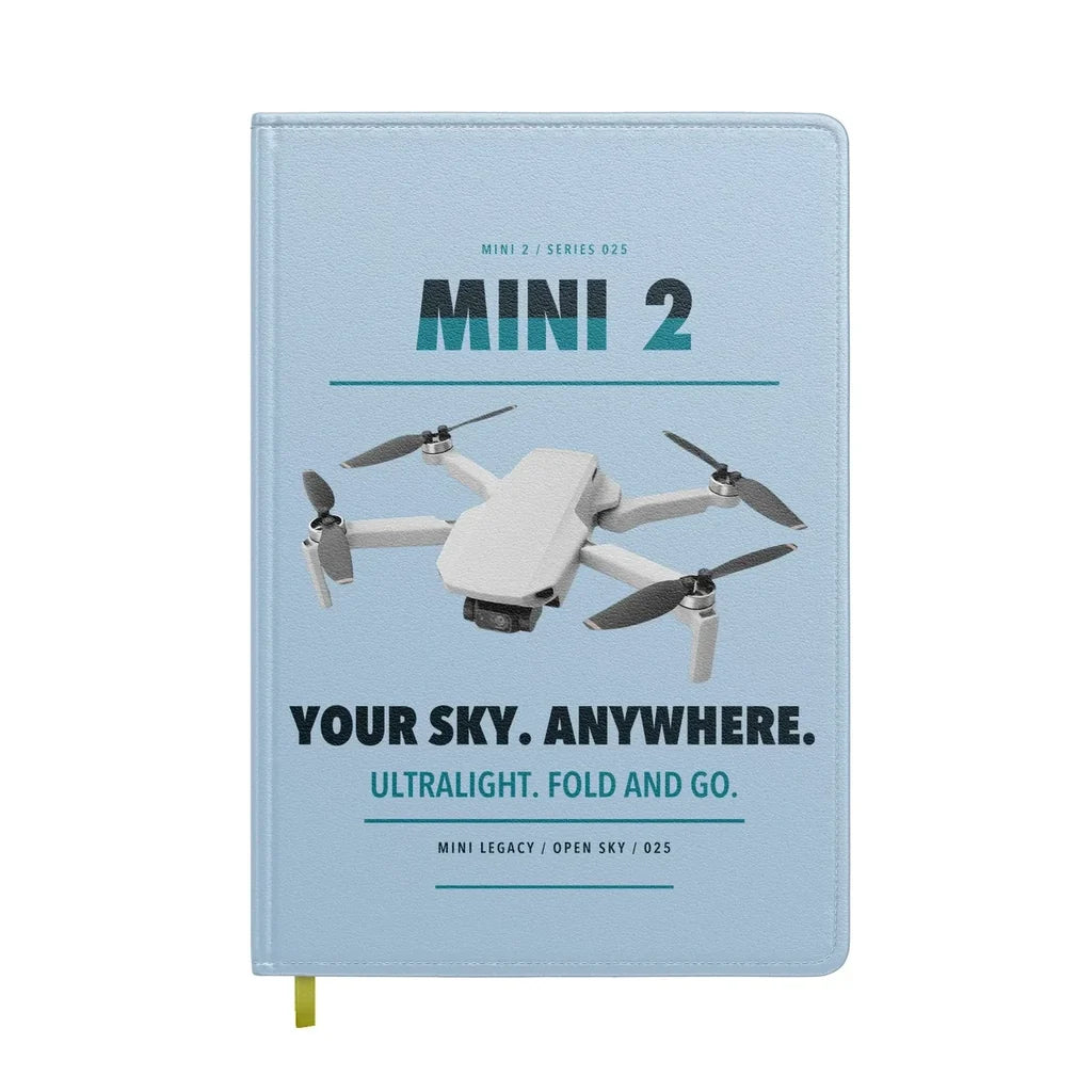 DJI Mini 2 design on light blue notebook