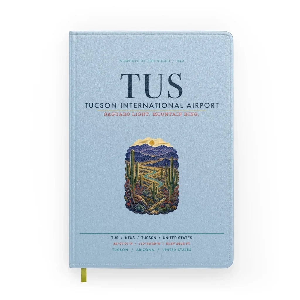 Tucson International Airport (TUS) design on light blue notebook