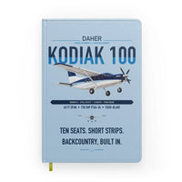 Thumbnail for Daher Kodiak 100 Series III design on light blue notebook