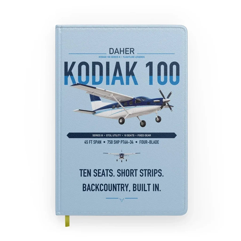 Daher Kodiak 100 Series III design on light blue notebook