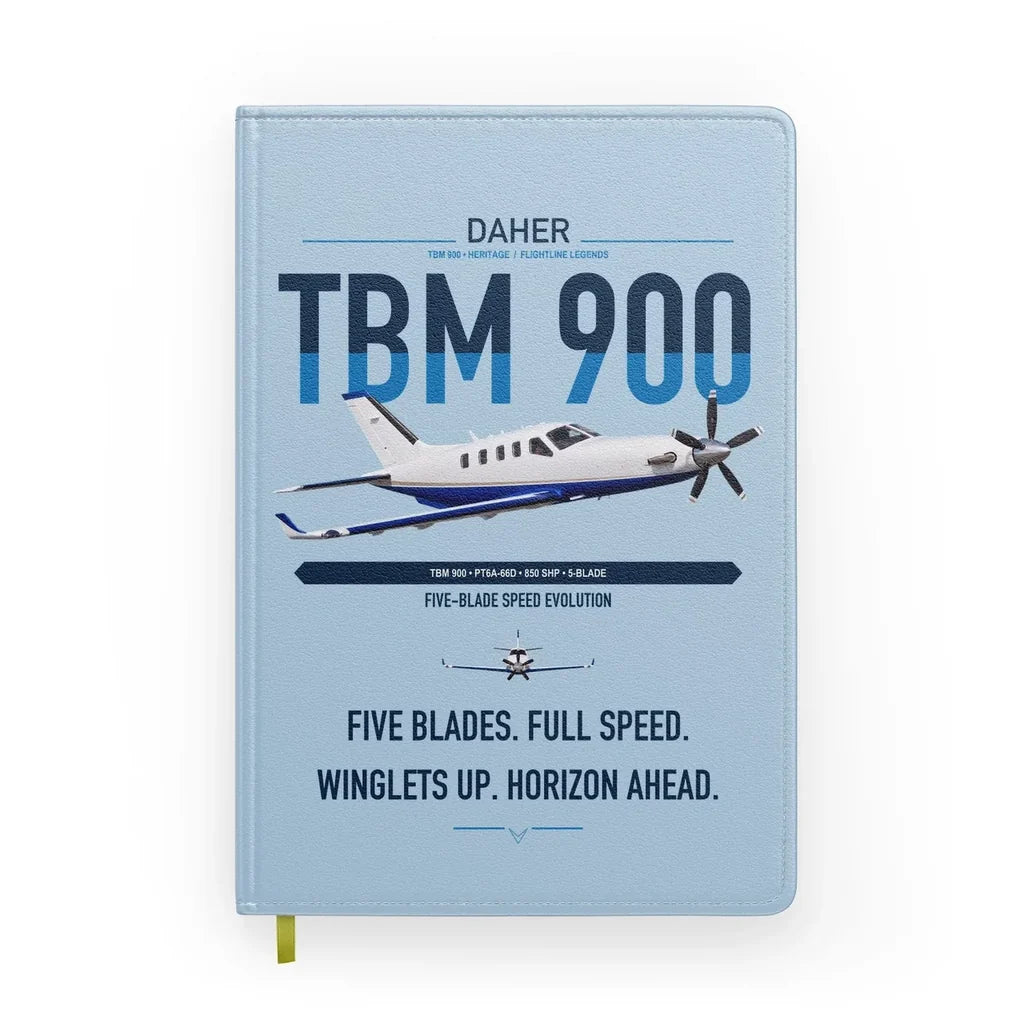 Daher TBM 900 design on light blue notebook