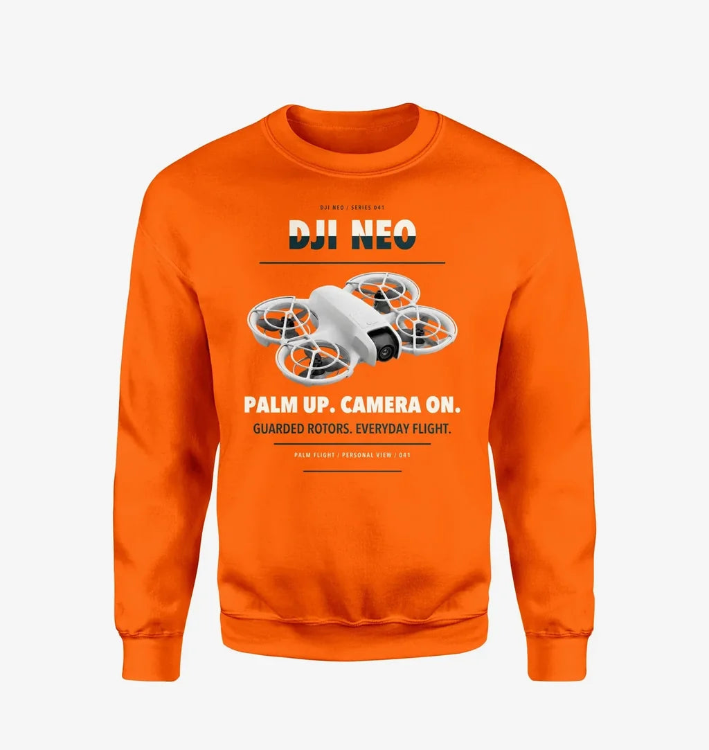 DJI Neo design on orange sweatshirt